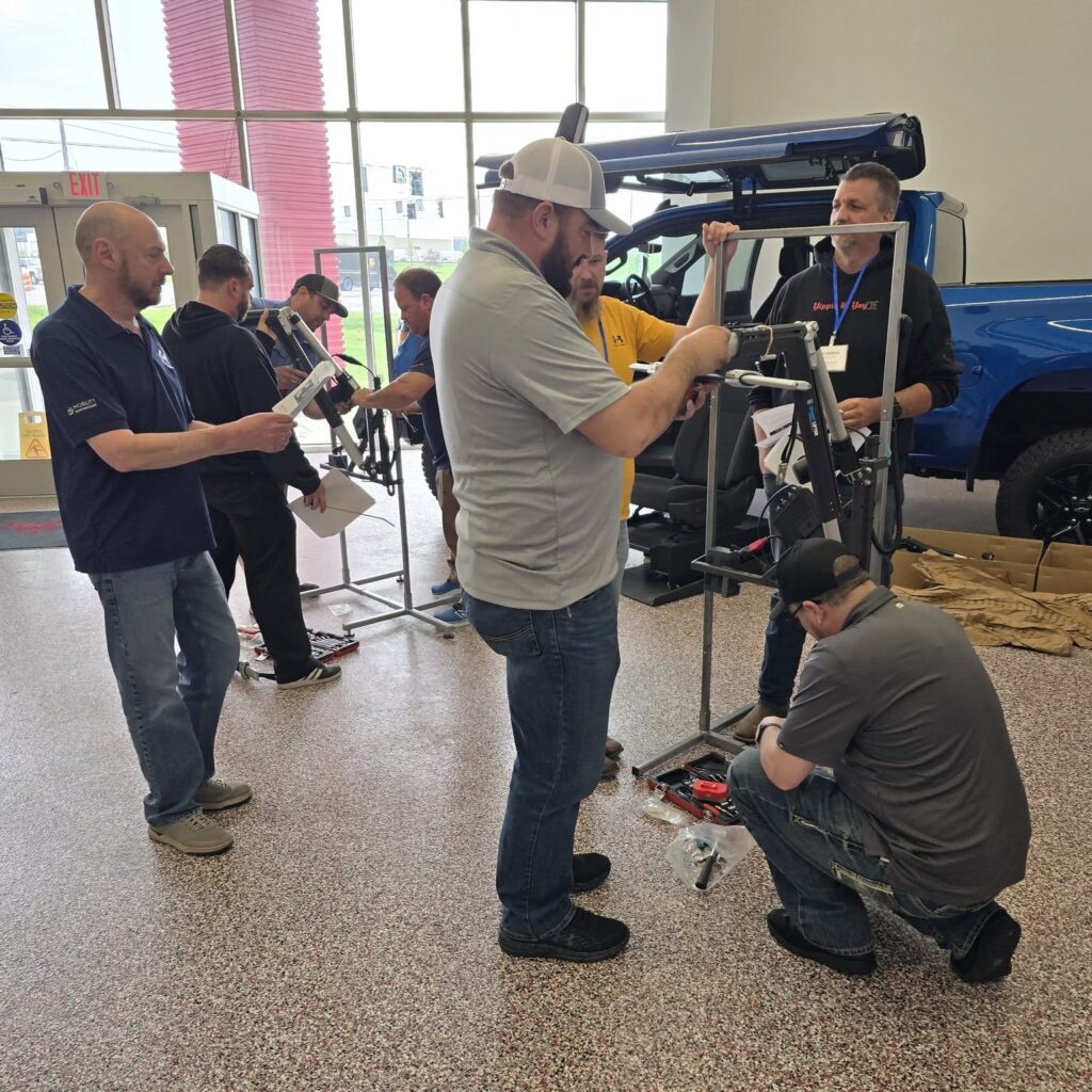 group of mobility engineers undertaking training of Smart Lifter demo units at NMEDA training event